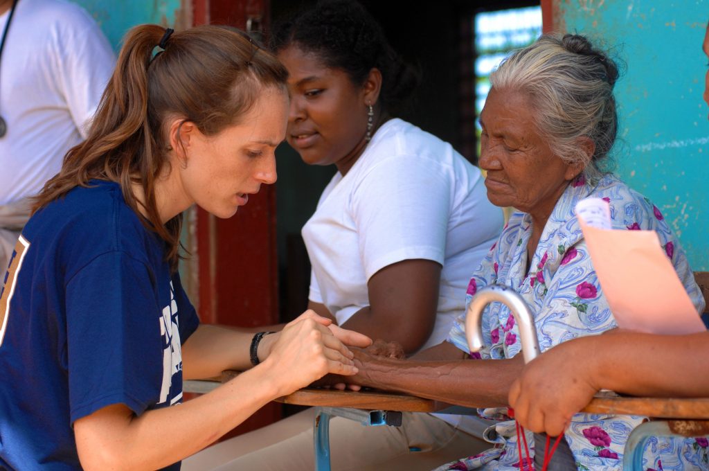 080815-N-7540C-148 PUERTO CABEZAS, Nicaragua (Aug.15, 2008) Project Hope volunteer Sara Joyce, embarked aboard the amphibious assault ship USS Kearsarge (LHD 3), examines the hand of an elderly Nicaraguan woman at a medical clinic at Juan Comenius High School during a Continuing Promise 2008 humanitarian assistance project. Kearsarge is the primary platform for the Caribbean phase of Continuing Promise, an equal-partnership mission involving the United States, Canada, the Netherlands, Brazil, Nicaragua, Panama, Colombia, Dominican Republic, Trinidad and Tobago and Guyana. (U.S. Navy photo by Mass Communication Specialist 1st Class David G. Crawford/Released)